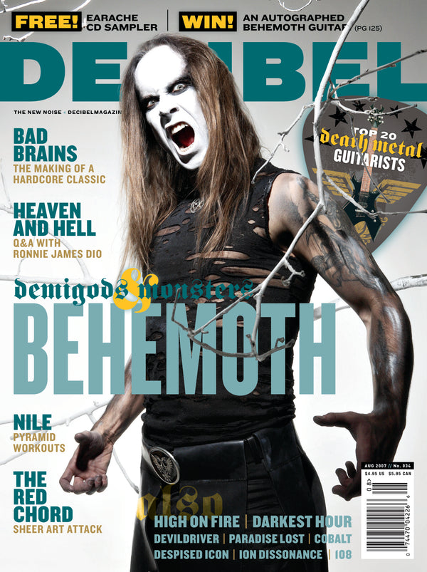 Magazine cover featuring a musician with long hair and white makeup, holding a branch.
