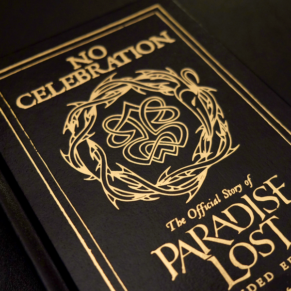 Close-up of a book cover with gold text and design.