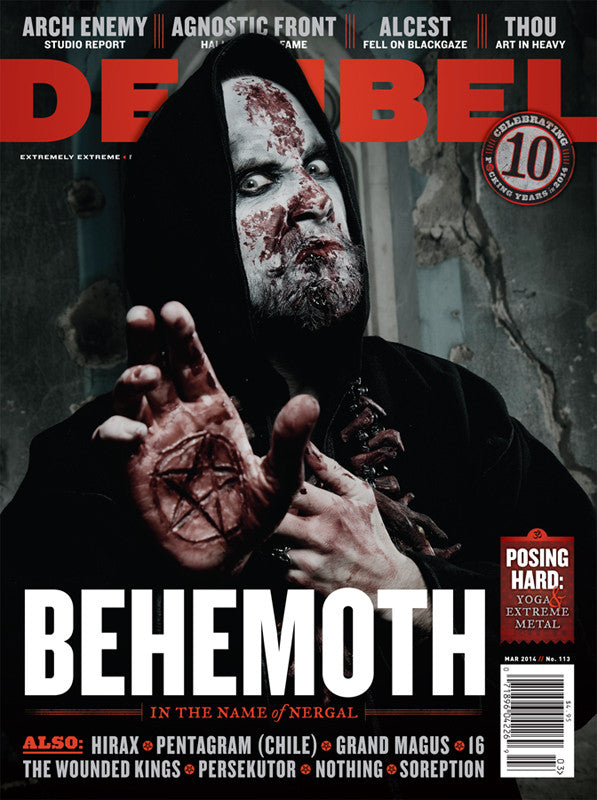 Cover of a magazine issue featuring a band called Behemoth, with member posing in a dramatic manner, characteristic of a heavy metal magazine.