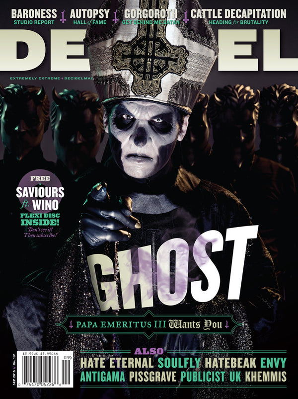 Magazine cover featuring a band named Ghost with members dressed in dark costumes and makeup, typical of a heavy metal band. The text on the magazine mentions exclusive limited edition Saviours ft.