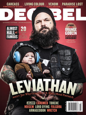 decibel magazine featuring Leviathan's jef whitehead holding a baby