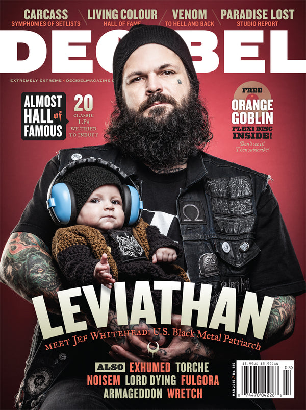 decibel magazine featuring Leviathan's jef whitehead holding a baby